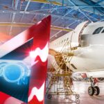 An airplane in the foreground with a projected paint masking pattern overlay, being assisted by ProjectionWorks technology. The technology is used to improve efficiency and accuracy in the paint masking process.