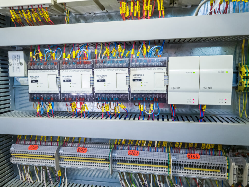 Optimizing Industrial Systems with PLC Programming